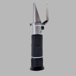 Side view of analogue colostrum Brix refractometer with daylight plate open and adjustment screw