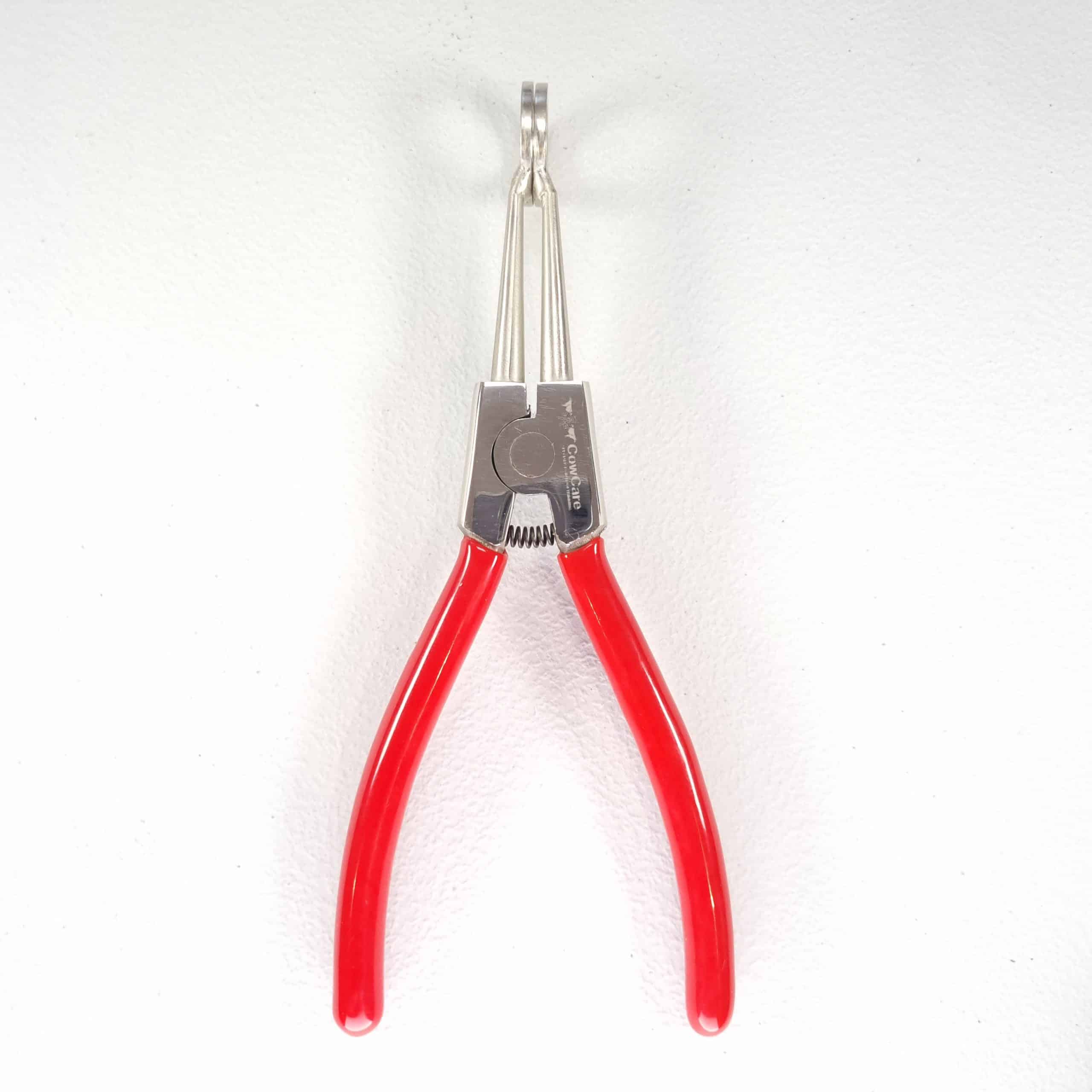 Hoof Spreaders — Cattle Claw Separation Tool 1 Hoof It cattle claw spreader shown upright with pointed prongs, spring pivot and open red handles