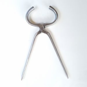 Hoofit stainless steel hoof tester with jaws fully open, showing pivot screw and gripping surfaces
