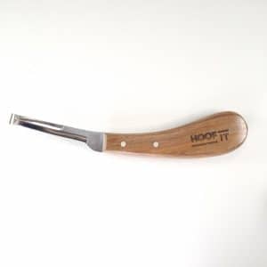 Hoof It hoof knife with a curved blade and flat scraping tip, riveted wooden HOOF IT handle, side view