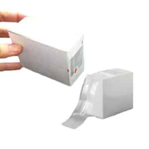 AI gun sanitary sheath being dispensed from the dispenser box by hand for cattle artificial insemination